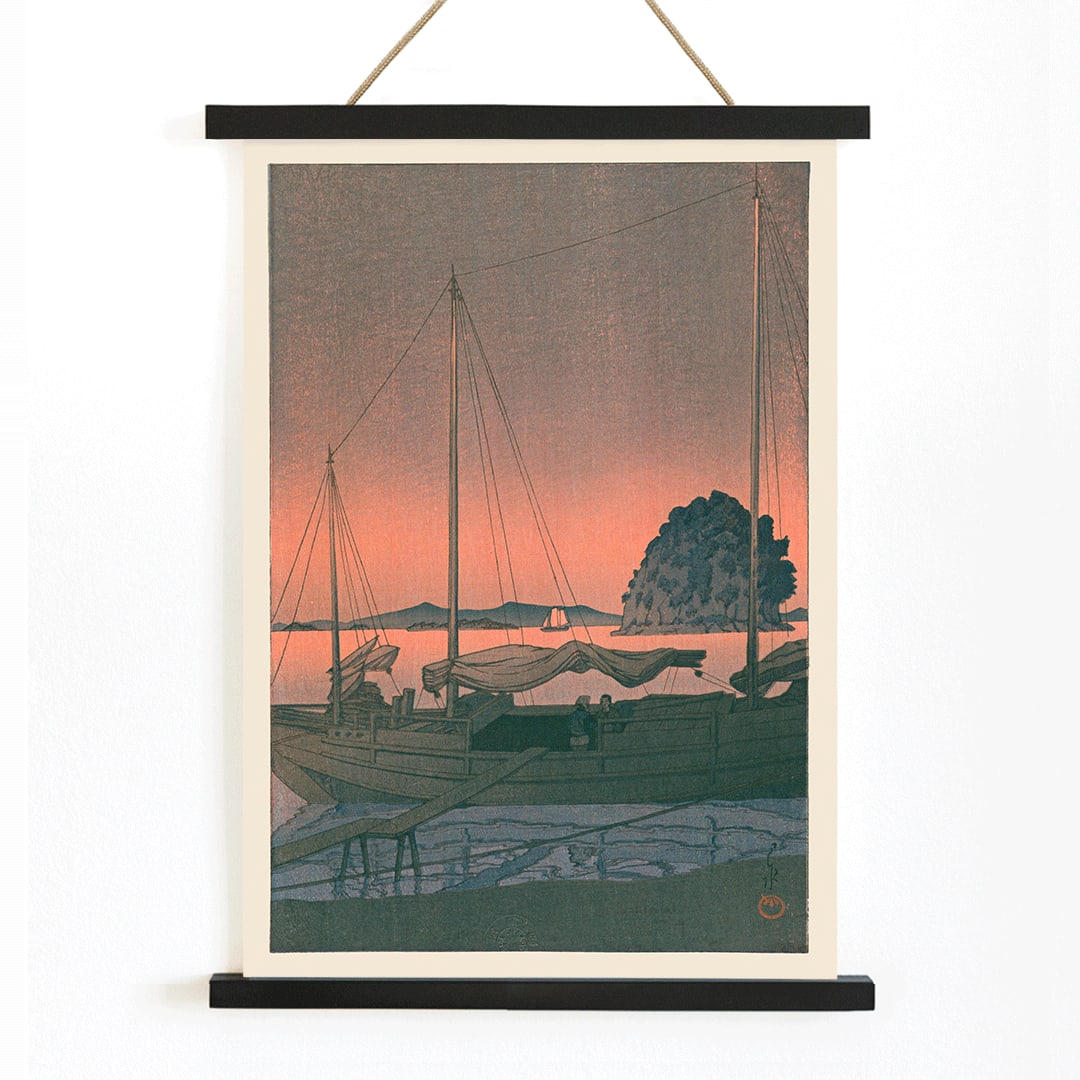 Ukiyo e Harbour Sunset by Kawase Hasui with boats docked at sunset tranquil evening sky island and mountains in background, with wooden magnetic frame on white background