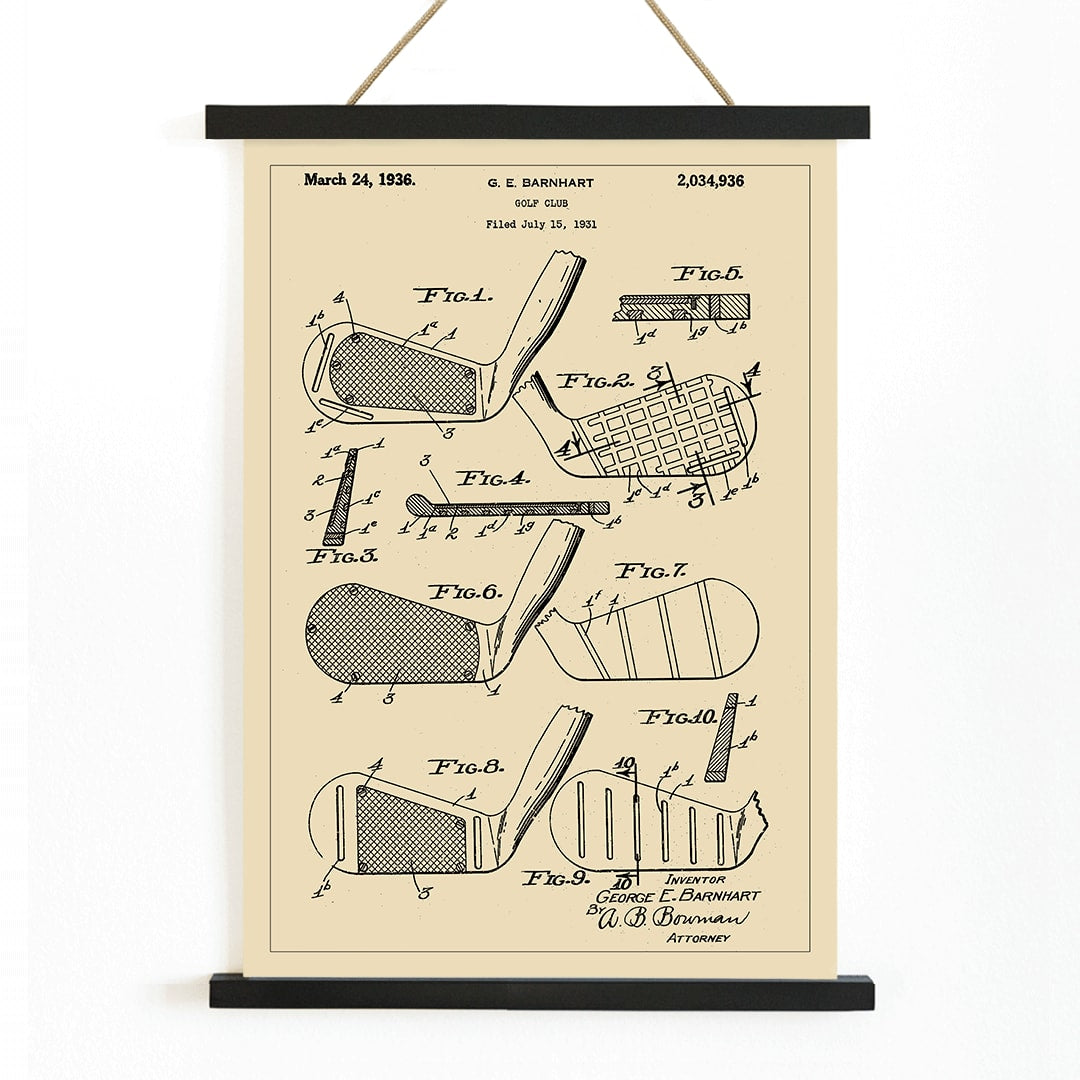 Golf club patent illustration by GE Barnhart showing detailed diagrams and labeled parts, with wooden magnetic frame on white background