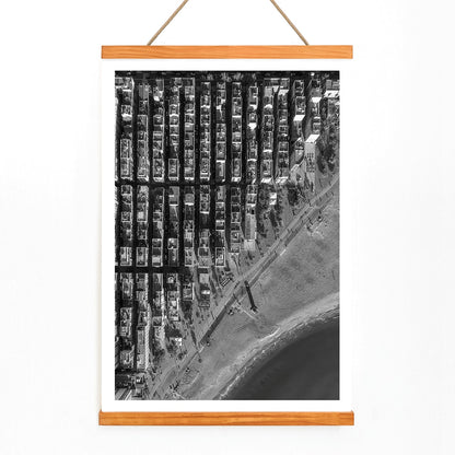 Aerial cityscape and black and white poster of Barceloneta beach and city grid aerial view, with wooden magnetic frame on white background