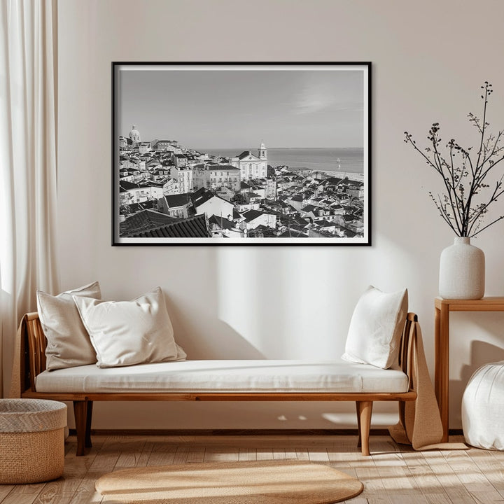 Black and white landscape poster of Alfama Lisbon Old City with traditional buildings and Tagus River by artist Alfama Lisbon, framed and displayed in home decor