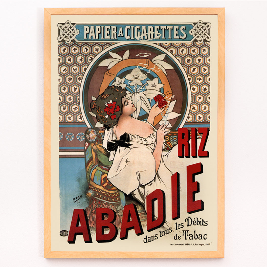 Closeup detail of Art nouveau posters by Alphonse Mucha featuring women with floral backgrounds and Riz Abadie cigarette papers