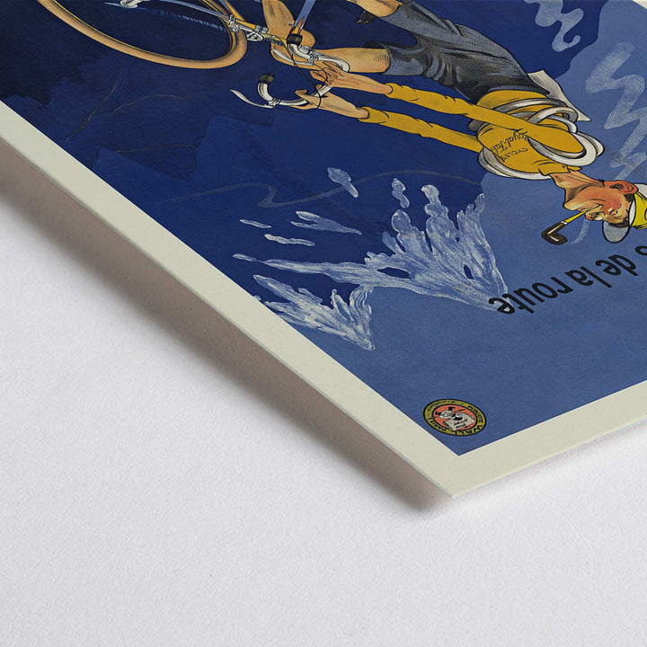 Closeup detail of Michel Liebeaux Royal-Fabric bicycle poster with cyclist riding uphill in yellow gear against a moody blue mountain sky