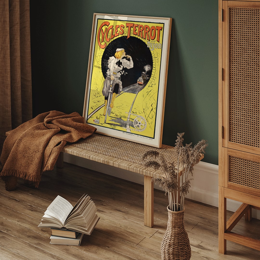 Vintage poster of a woman riding a bicycle in a tunnel with a train approaching Cycles Terrot Dijon artwork, framed and displayed in home decor