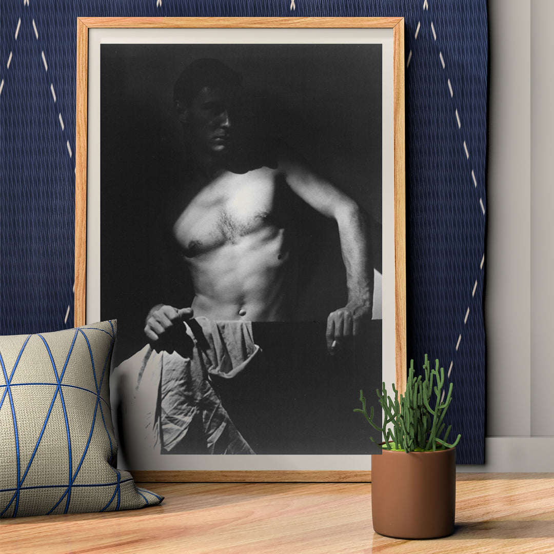 Shirtless man holding towel in dramatic lighting Max After Surfing by Olive Cotton wall art photography poster, framed and displayed in home decor