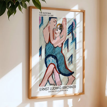 Dancing Couple in the Snow by Ernst Ludwig Kirchner vibrant expressive painting of a couple embracing and dancing in a snowy scene, framed and displayed in home decor