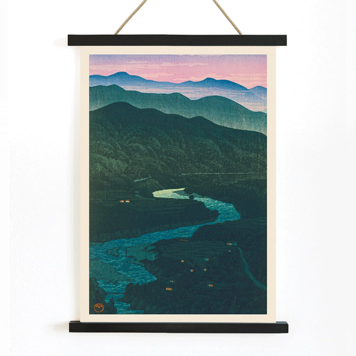 Ecchu Umidani Pass by Kawase Hasui landscape artwork showing mountains and a winding river at dawn and dusk, with wooden magnetic frame on white background