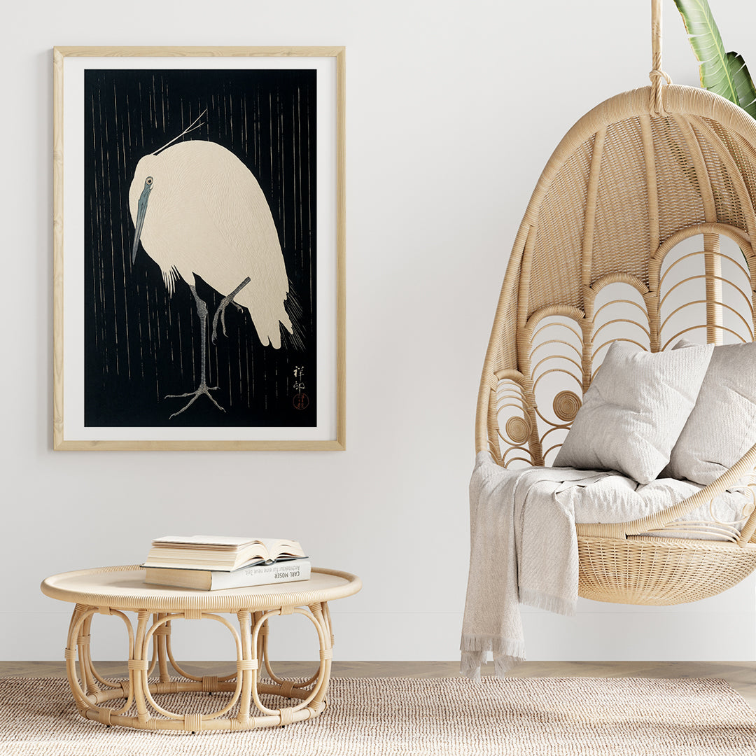 White egret standing in the rain art print poster with dark background by Ohara Koson, framed and displayed in home decor