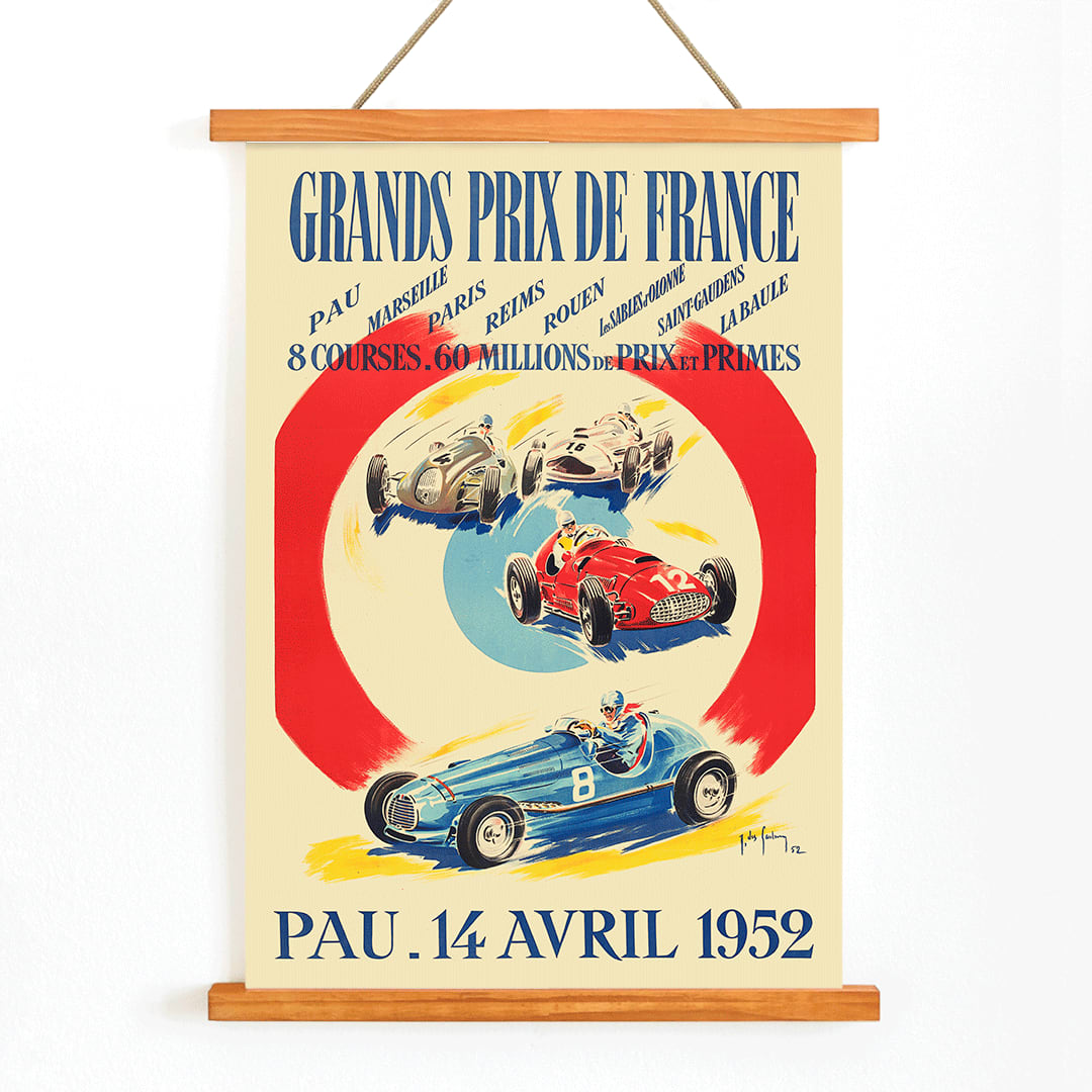 Vintage poster by Jean Des Gachons showing colorful race cars and event details for Grands Prix de France at multiple locations, with wooden magnetic frame on white background