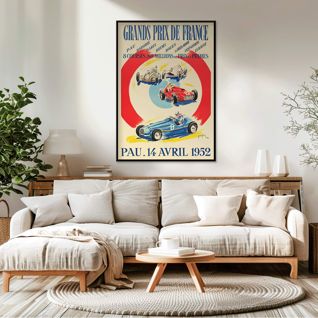 Vintage poster by Jean Des Gachons showing colorful race cars and event details for Grands Prix de France at multiple locations, framed and displayed in home decor