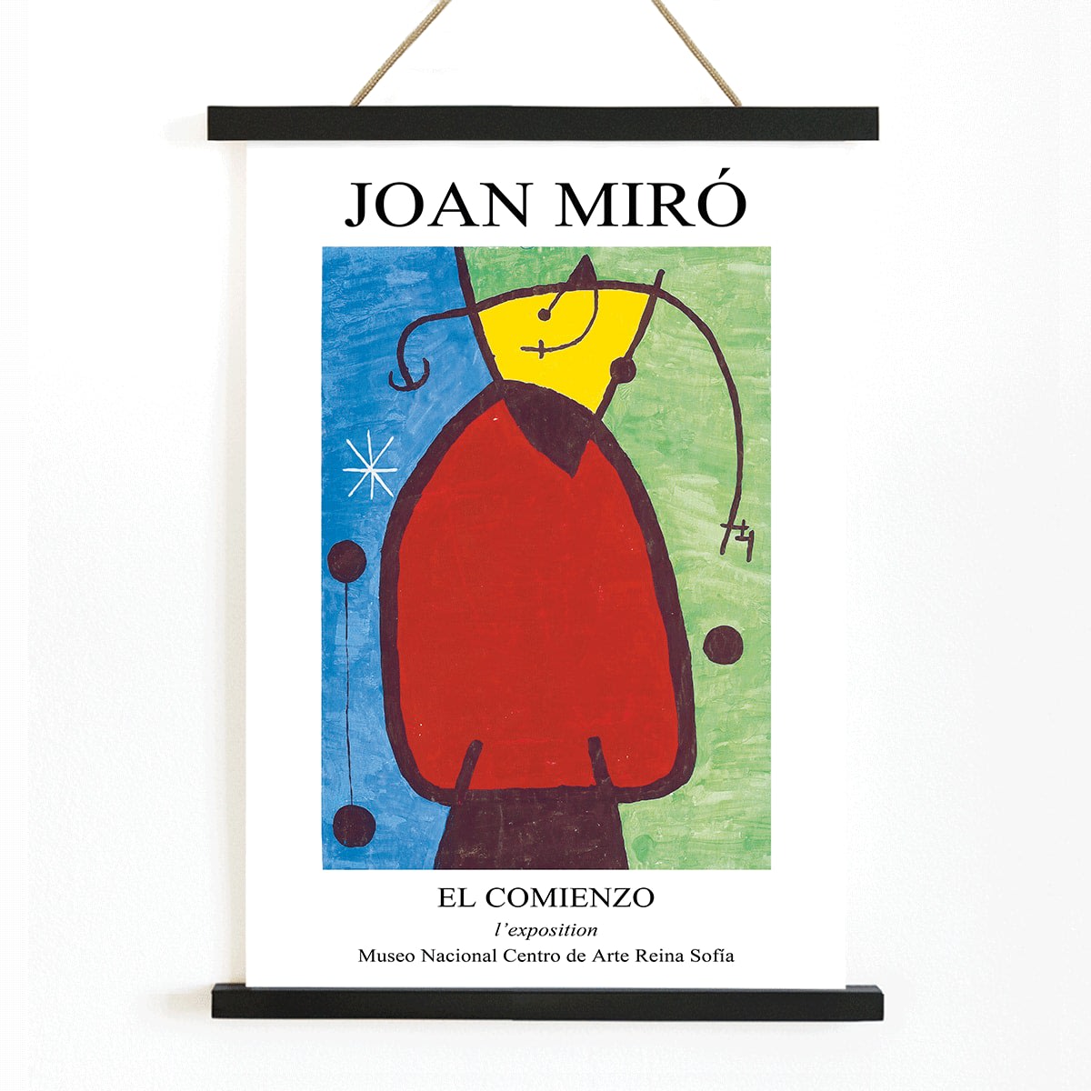 Exhibition poster of El Comienzo by Joan Miro with colorful abstract shapes and vibrant colors in a framed display, with wooden magnetic frame on white background