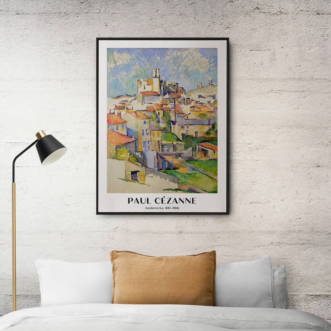 Colorful village landscape painting and poster of Gardanne by Paul Cézanne featuring red roofed houses and bright sky, framed and displayed in home decor