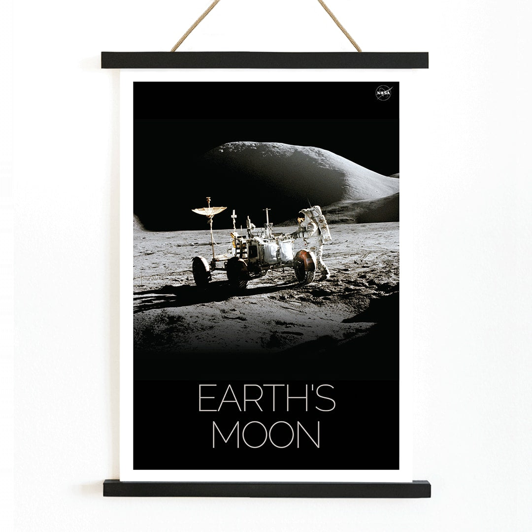 Astronaut beside lunar rover on the moon surface Man on Moon 1 by NASA poster with Earths Moon text, with wooden magnetic frame on white background