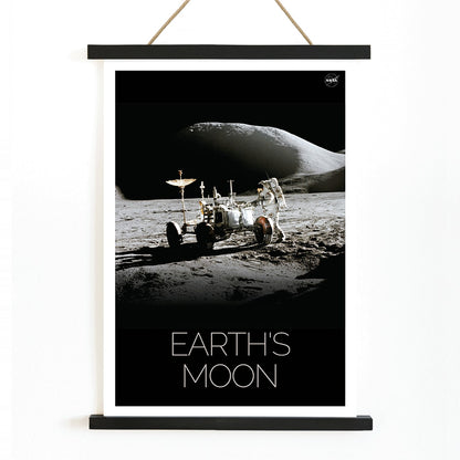 Astronaut beside lunar rover on the moon surface Man on Moon 1 by NASA poster with Earths Moon text, with wooden magnetic frame on white background