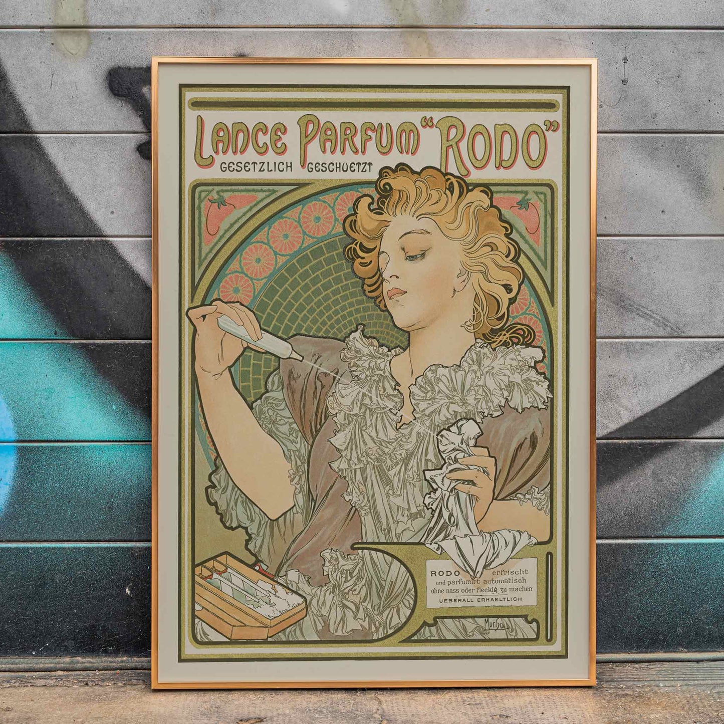 Alphonse Mucha Lance parfum Rodo poster Art Nouveau woman with flowing hair floral border soft green gold tones, framed and displayed in home decor