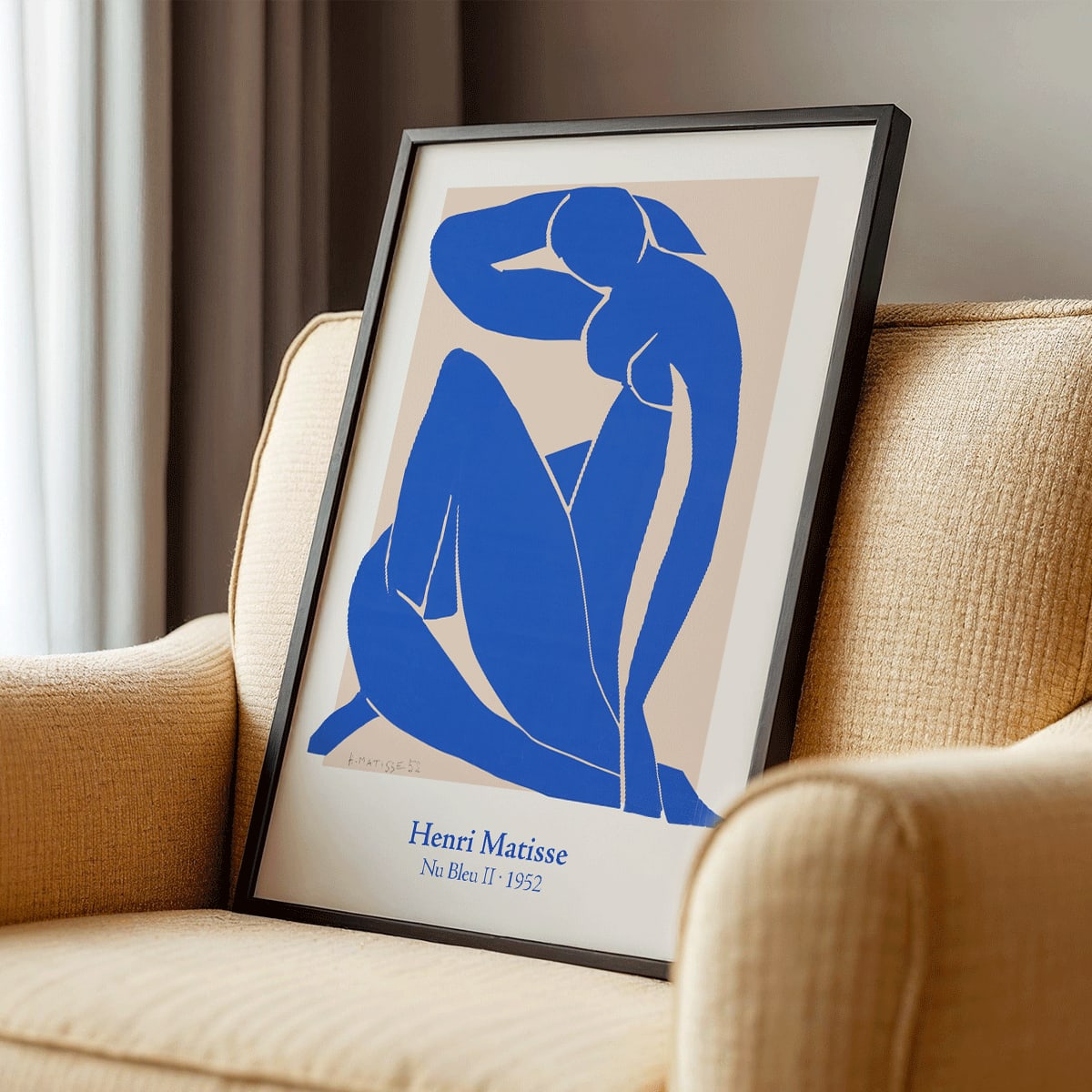 Nu Bleu II by Henri Matisse blue abstract figure art print poster on beige background framed, framed and displayed in modern living room decor