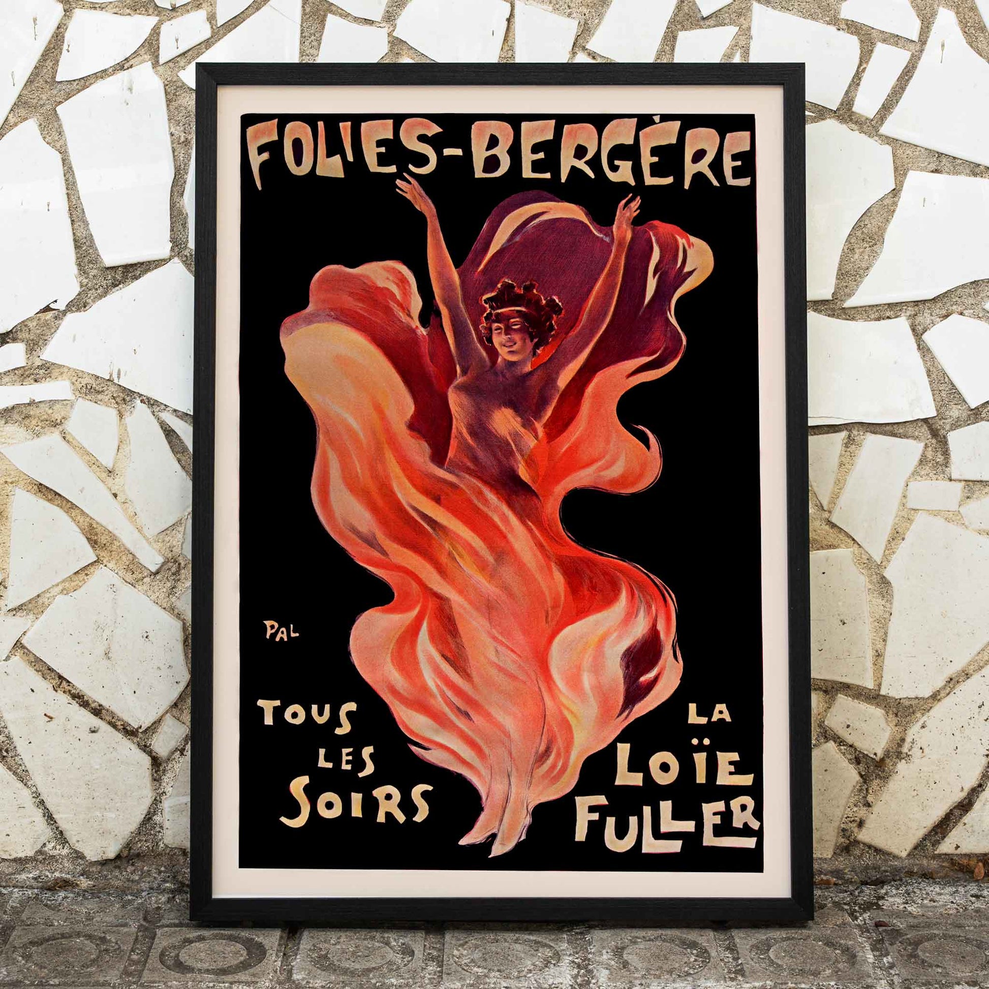 Folies-Bergere La Loie Fuller by Pal vibrant poster artwork featuring a dancing woman with flowing and swirling colorful fabric, framed and displayed in modern living room decor