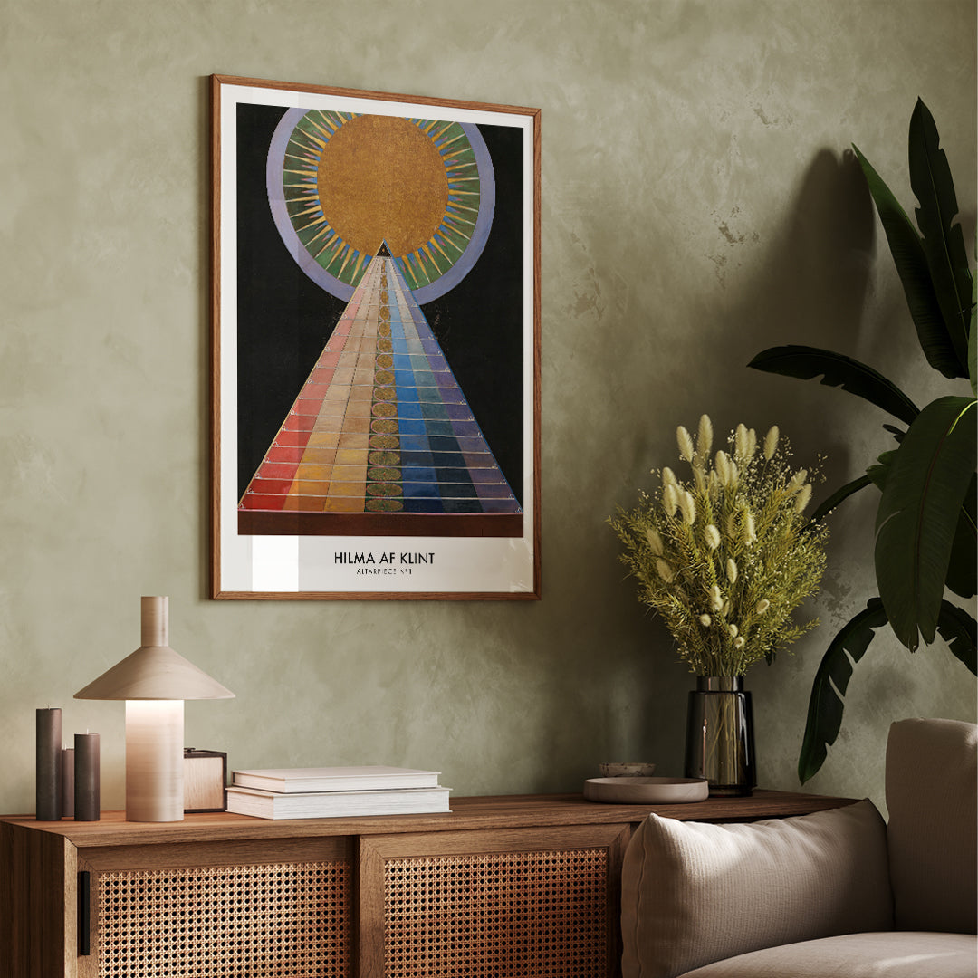 Colorful geometric abstract art poster with radiant circle pyramid and sun motif by Hilma AF Klint Altarpiece No 1 Group X, framed and displayed in modern living room decor
