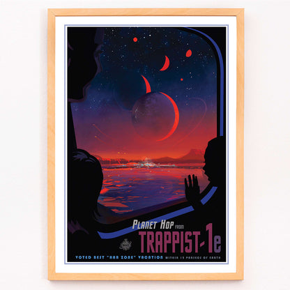 Colorful sci fi poster of TRAPPIST-1e by NASA showing vibrant alien landscape with planets glowing sky and silhouetted figures viewed from a window, framed and displayed in modern living room decor