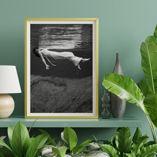 Underwater woman in white flowing dress at Weeki Wachee spring Florida by Toni Frissell, framed and displayed in home decor