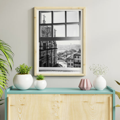 Black and white cityscape poster of Porto seen through a window from the artwork Porto from window, framed and displayed in home decor